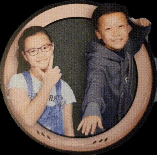 a boy and a girl are posing for a picture and the girl is wearing a shirt that says rr