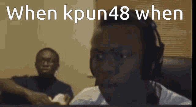 a man wearing headphones looks at the camera with the words when kpun48 when below him