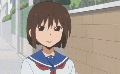 a cartoon girl with short brown hair and a blue sailor uniform