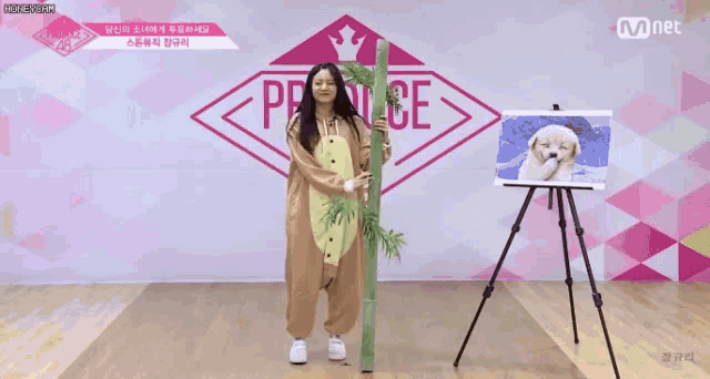 a woman in a bear costume is standing in front of a sign that says produce