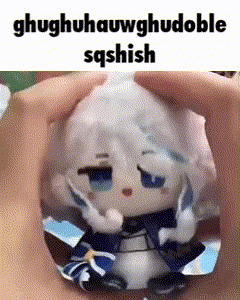 a person is holding a stuffed animal that looks like a cartoon character with a broken head .
