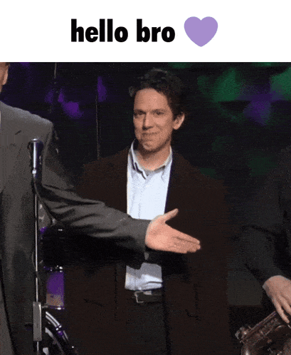 a man in a suit shakes another man 's hand with the words hello bro written above him
