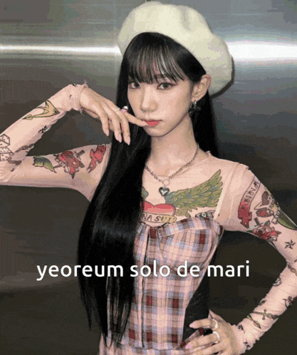 a woman with a tattoo on her arm and the words yeorem solo de mari