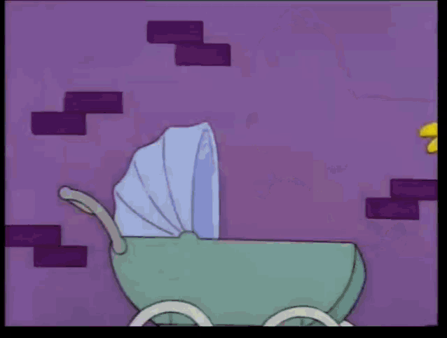 homer simpson is holding a baby in a stroller