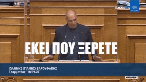a man giving a speech in front of a podium that says " exei pou epete " on it