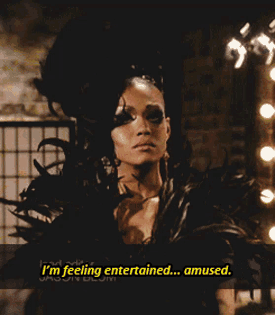 a woman in a black costume says i 'm feeling entertained ... amused