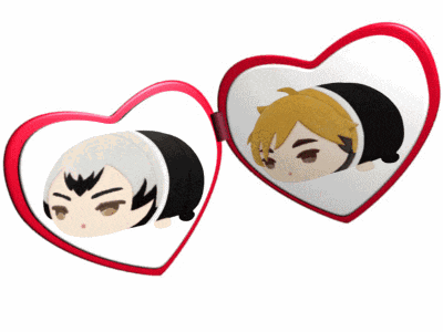a pair of heart shaped mirrors with cartoon faces on them