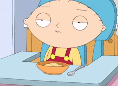 a cartoon character sitting at a table holding a gun