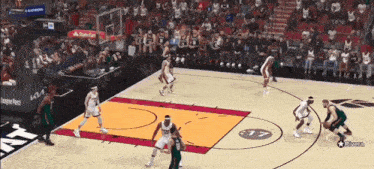 a basketball game is being played on a court with a santander sign in the stands