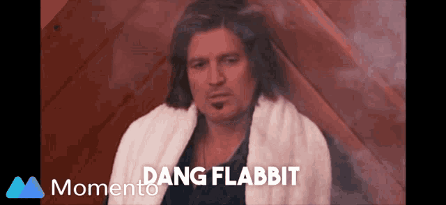 a man with a towel around his neck and the words " dang flabbit " on the bottom