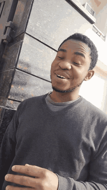a man with his eyes closed and his mouth open