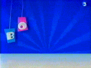 a cartoon character is standing in front of a blue background with the word bonjour hanging from the ceiling .