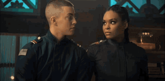 a man and a woman looking at each other
