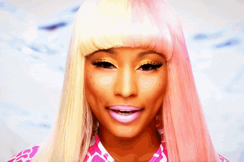 a close up of a woman 's face with pink and blonde hair