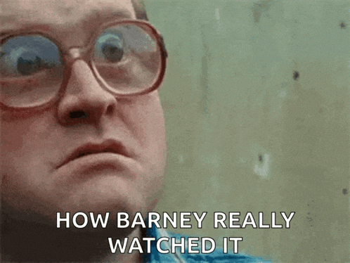 a close up of a man wearing glasses with the words how barney really watched it