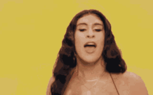 a woman in a bikini is giving the middle finger