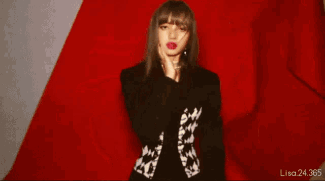 a close up of a woman 's face with a red background and the number 24 365 on the bottom