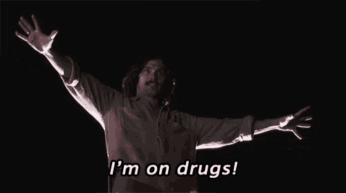 a man with his arms outstretched says " i 'm on drugs "