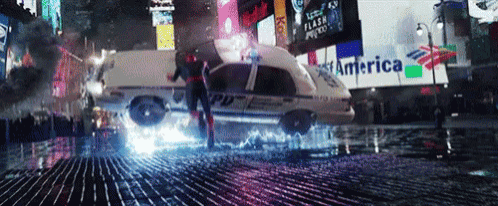 a police car is flying through the air in a city street