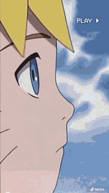 a close up of a cartoon character with a g on his head .