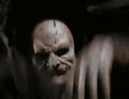 a close up of a skull with a scar on it in the dark .
