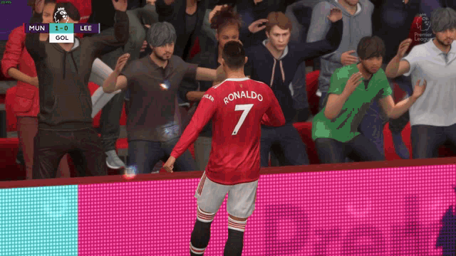 a soccer player named ronaldo stands in front of a crowd