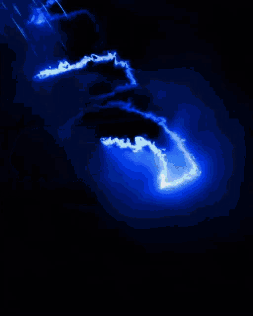 a blue lightning strike in the dark