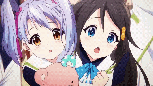 two anime girls are standing next to each other and one of them is holding a teddy bear with the letter c on it