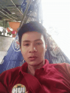 a young man is laying in a hammock wearing a red shirt that says hulk on it