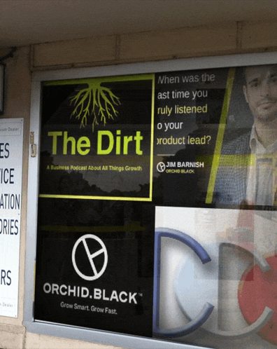 a window with a sign that says " the dirt " on it