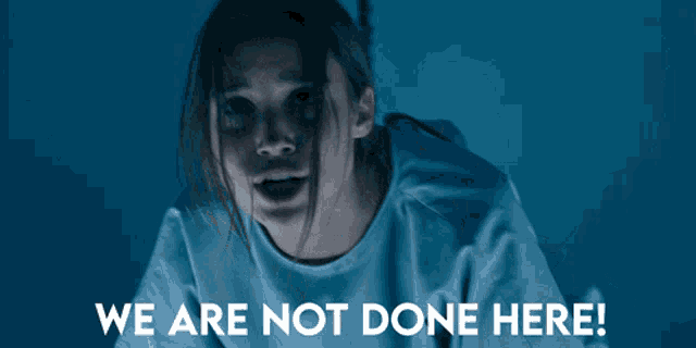 a woman in a hospital gown with the words we are not done here below her