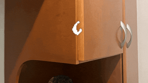 a wooden cabinet with a pixelated c on the side