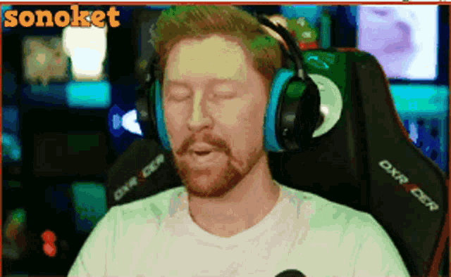 a man wearing headphones sits in a chair with the word sonoket on the bottom right