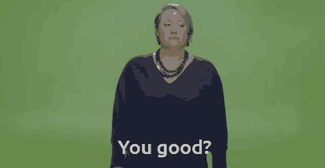 a woman in a blue sweater says you good on a green background