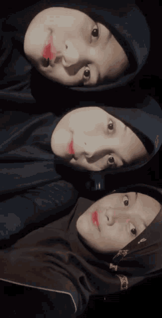 three girls wearing hijabs pose for a picture together