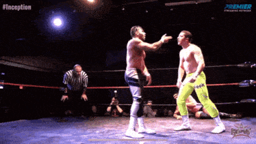two wrestlers in a ring with the hashtag #inception on the bottom
