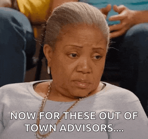 an elderly woman is sitting in a stadium and says now for these out of town advisors