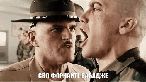 a man in a hat is yelling at another man in a camouflage uniform
