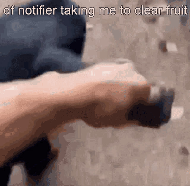 a close up of a person 's hand with the words " df notifier taking me to clear fruit "
