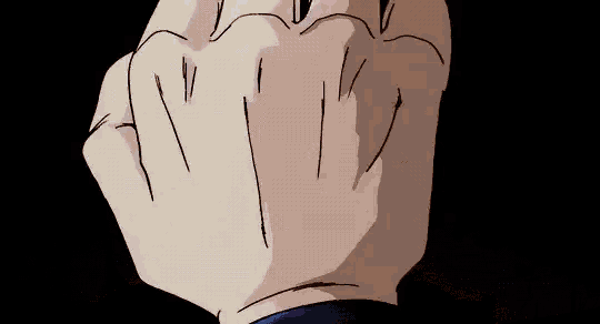 a close up of a person 's fist on a black background