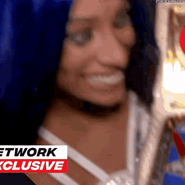 a close up of a woman 's face with the words network exclusive behind her