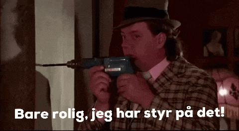 a man in a hat is holding a drill in his mouth and says bare rolig , jeg har styr på det .