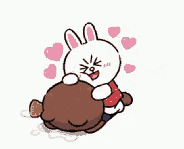 a bunny is laying on top of a brown bear with hearts around them .