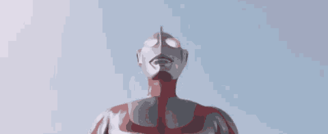 a blurred image of a person 's torso and legs against a blue sky