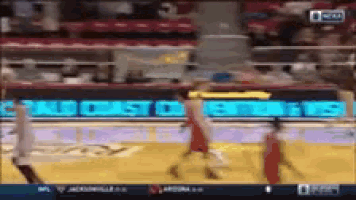 a basketball game is being played in front of a banner that says cristo
