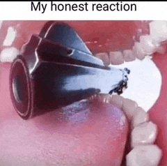 a close up of a gun in a person 's mouth .