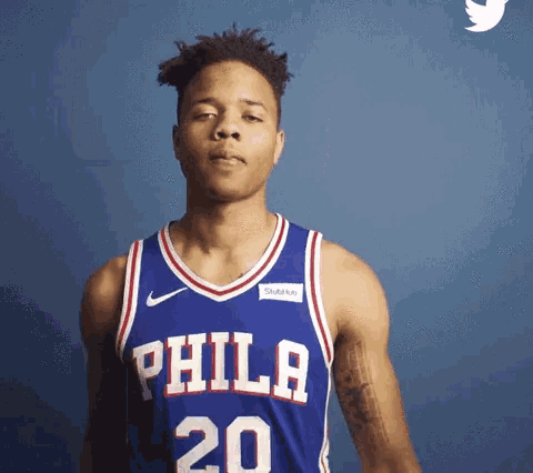 a man wearing a philadelphia jersey with the number 20