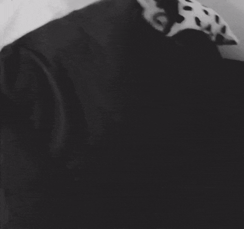 a black and white photo of a person laying down