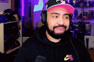 a man with a beard wearing headphones and a nike hoodie