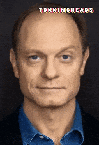 a man 's face is shown with the words tokingheads above him